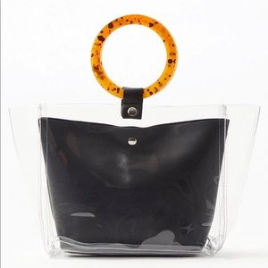 Clear tote with tortoise handles